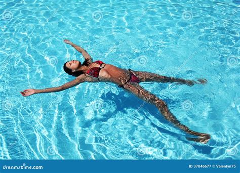 Young Woman Relaxing in Pool. Stock Image - Image of swim, bikini: 37846677