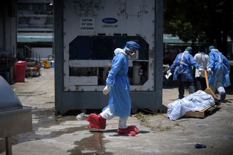 Ecuador stores coronavirus victims in giant fridges as morgues fill up ...