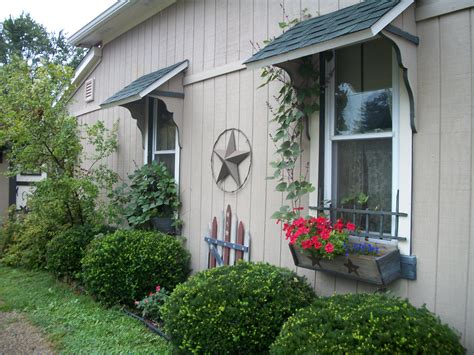 My home with window boxes, flag gate and awnings that I made. The stars ...