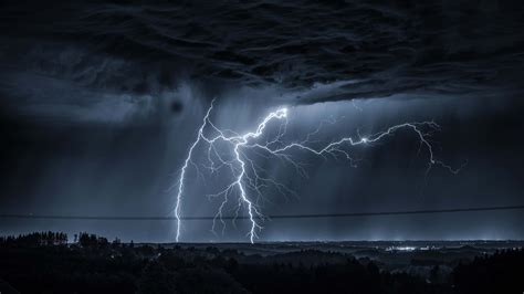 Download Dramatic Lightning Strike In 4k Resolution Wallpaper | Wallpapers.com