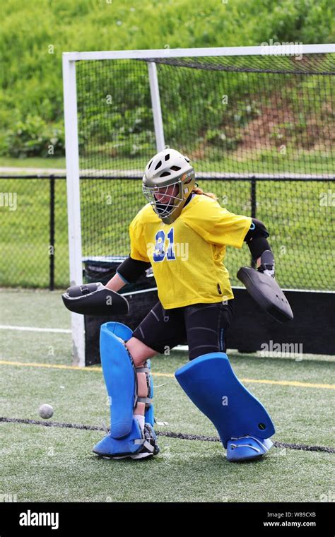 The field hockey goalie makes a kick save Stock Photo - Alamy