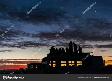 Silhouette People Watching Sunset Top Bus Festival Stock Photo by ©SunshineSeeds 201980026