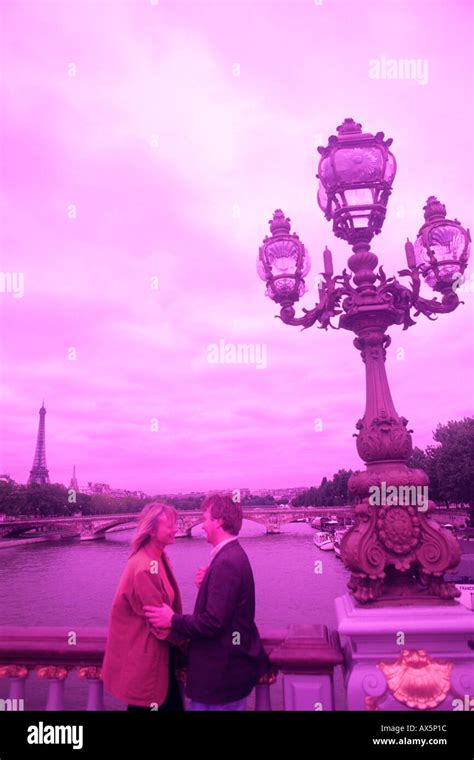 romantic couple in Paris on the Seine River in Paris France Stock Photo - Alamy