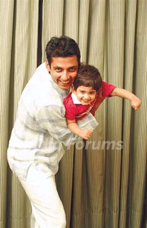 Ajay Jadeja with Son Aiman shown to user Photo