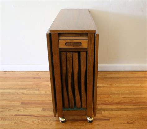 Drop Leaf Table With Storage For Folding Chairs - A multi-utility device serving a variety of ...