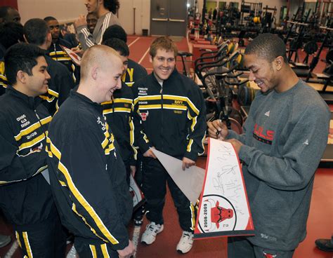 File:US Navy 090121-N-8848T-928 Chicago Bulls guard Derrick Rose signs autographs for a group of ...