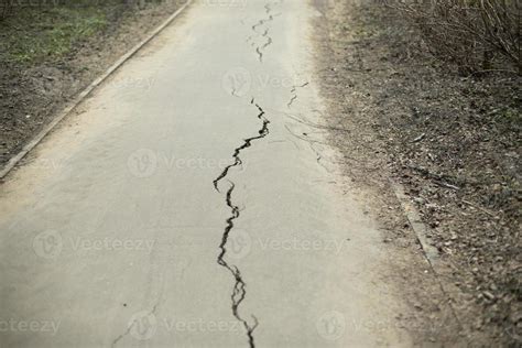 Crack in asphalt. Road with defect. 16786157 Stock Photo at Vecteezy