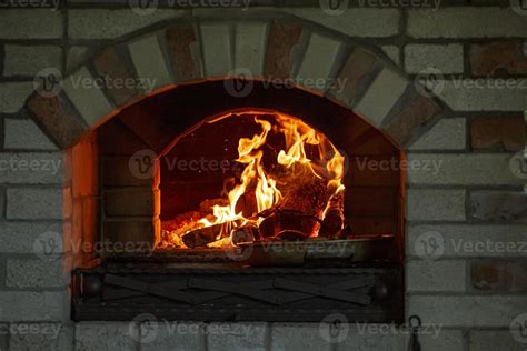 Burning log of wood in a fireplace close-up. 5392486 Stock Photo at Vecteezy