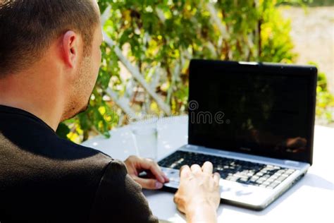 Man Working with Laptop Outside Stock Photo - Image of looking, laptop: 15200680