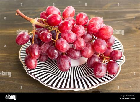 Red Sultana Seedless Grapes on a Plate Stock Photo - Alamy