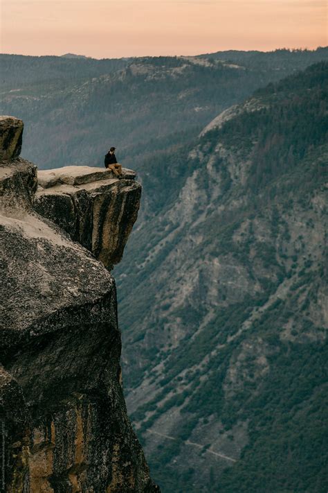 "Man Standing At The Edge Of A Mountain Cliff In Yosemite" by Stocksy Contributor "Mango Street ...