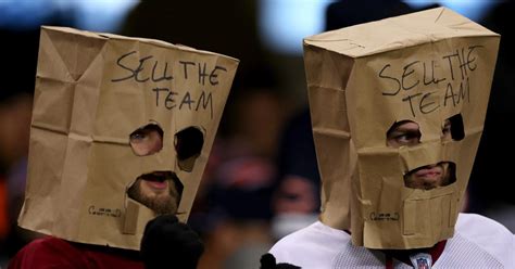 Commanders fans chant, have 'Sell the Team' signs and paper bags removed by security during ...