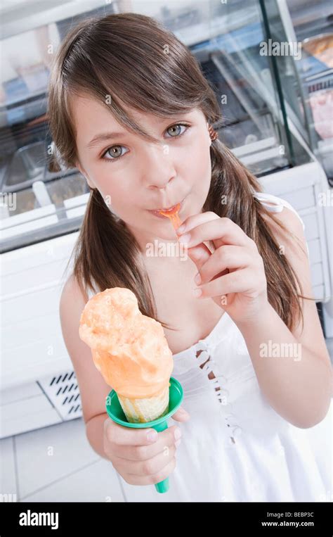 Girl eating an ice cream Stock Photo - Alamy