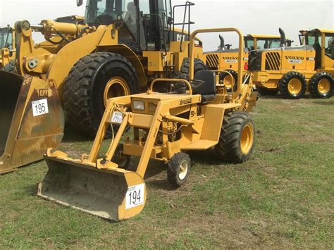 TERRAMITE T5C LOADER BACKHOE - J.M. Wood Auction Company, Inc.