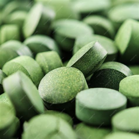 Premium Photo | Chlorella or spirulina tablets close up. Texture of tablets spirulina or chlorella.