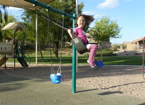 Free Images : kid, city, cute, female, youth, park, child, playing, swing, smiling, public space ...