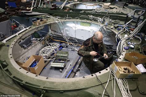 Inside a Russian tank factory: Fascinating photographs show the construction and testing of the ...