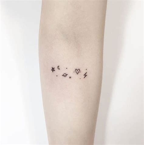 Minimalist space tattoo on the forearm - Tattoogrid.net