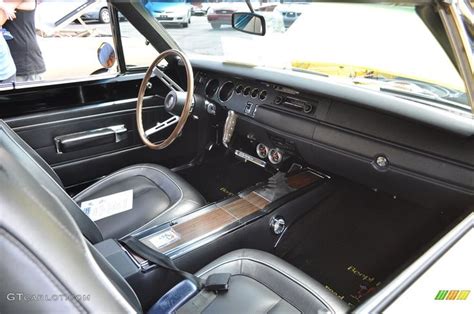 the interior of an old car with black leather seats and dash board ...