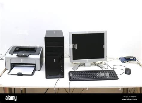 Desktop computer with display keyboard mouse and printer on desk Stock ...