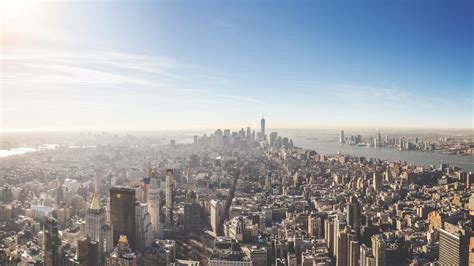 an aerial view of new york citys skyline and skyscrapers on a bright ...