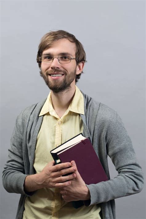 Young Man Standing Smiling Holding Books on Isolate Grey Stock Photo - Image of folder, document ...