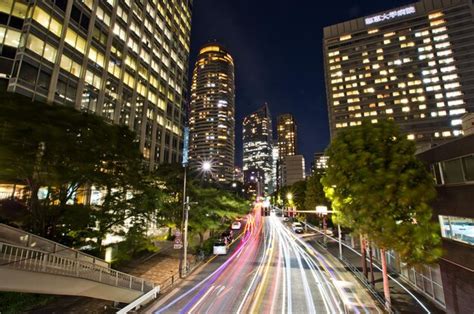 Premium Photo | Light trails of cars driving through tokyo at night