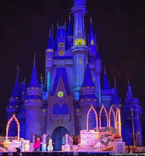 Like an Icy Blast Elsa Lights Up Cinderella Castle for the Christmas Season in Disney World ...