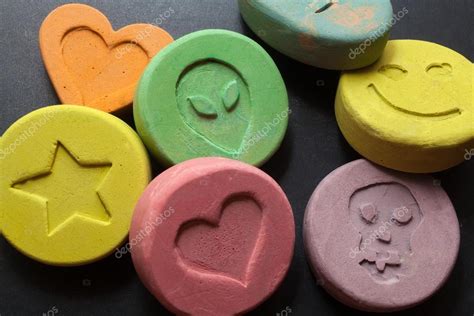 Ecstasy pills or tablets - Drugs — Stock Photo © portokalis #98597454