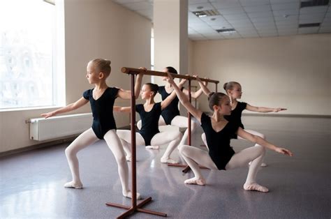 Premium Photo | Children are taught ballet positions in choreography.