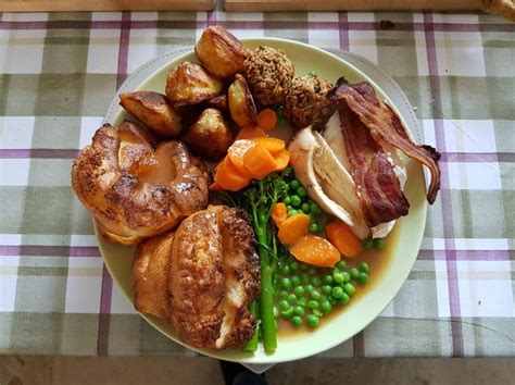 Sunday Dinner [OC] roast chicken Yorkshire puddings roast potatoes stuffing and veg oh and a bi ...