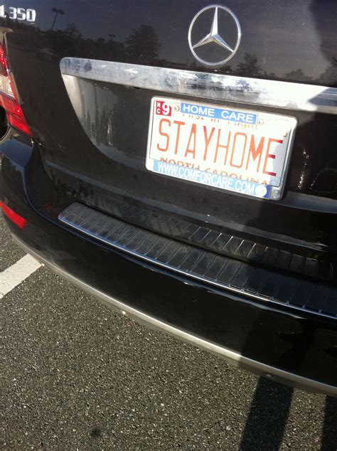 the back end of a car with a license plate that says stay home on it