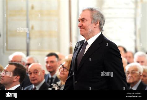 Russian conductor Valery Gergiev stands as President Vladimir Putin ...