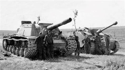 German soldiers and Stug III crew stands next to a Red Army captured ISU-152. July 1943. : TankPorn