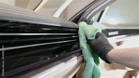 Side view of man taking care of car interior in garage. Cleaning ...