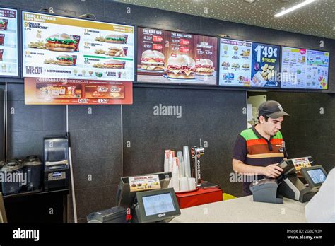 Restaurant burger king fast food man cashier menu hi-res stock photography and images - Alamy