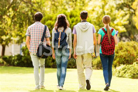 Rear View Of Students Walking On College Campus Stock Photo | Royalty ...