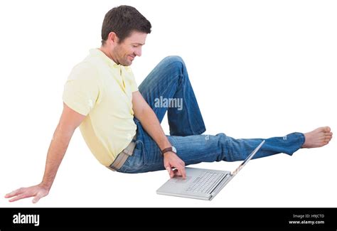 Smiling man using a laptop Stock Photo - Alamy