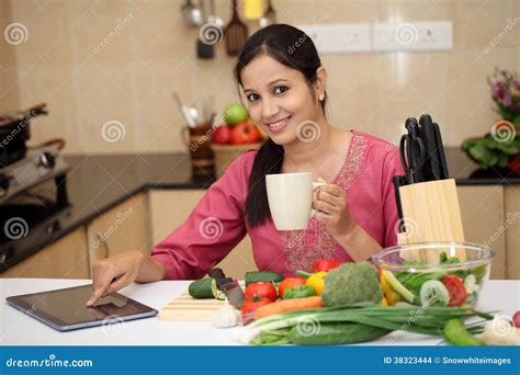 Woman Drinking Coffee in Her Kitchen Stock Photo - Image of latino ...