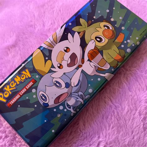 Pokemon tin with two packs of energy cards - Depop