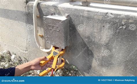 Grounding test on plant stock image. Image of hand, equipment - 145277065