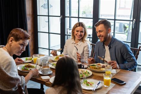 Premium Photo | Family eating together indoors