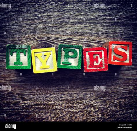 TYPES word written with wood block letter toys Stock Photo - Alamy