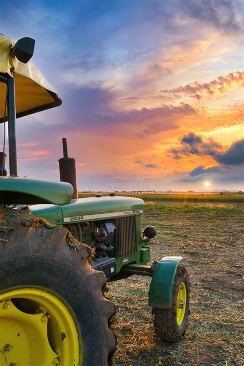 Tractor John Deere at the Beautiful Sunset of the Thessalian Plain ...