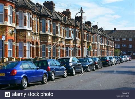 Typical East London terraced housing with residents car parking Stock ...