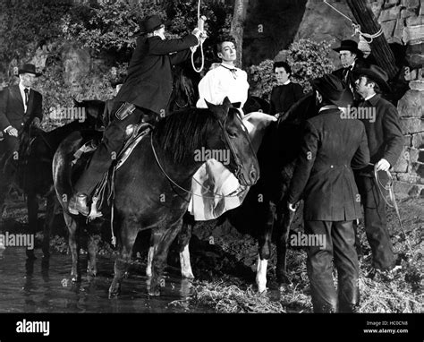 JOHNNY GUITAR, Clem Harvey (far left), Joan Crawford, Mercedes McCambridge, 1954 Stock Photo - Alamy