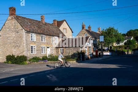 Wedmore, England, UK - May 31, 2020: Sun shines on Holy Trinity Church in the village of ...