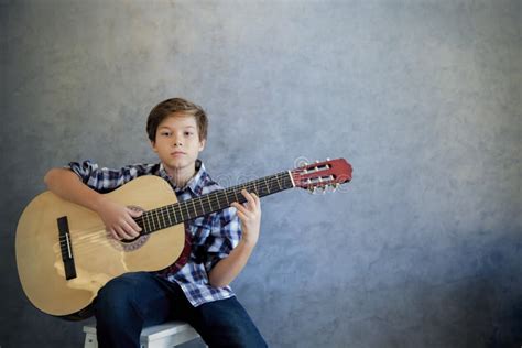 Teen Boy Playing Acoustic Guitar while Teen Girl Listening Him Stock ...