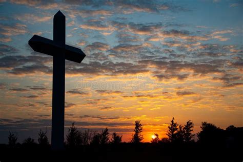 Cross at sunset stock photo. Image of faith, clouds - 162319640