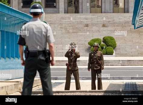 North Korean border soldiers take pictures of a South Korean border ...